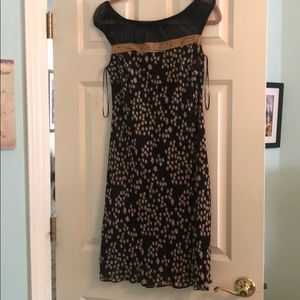 Black cocktail dress with tan flower detail